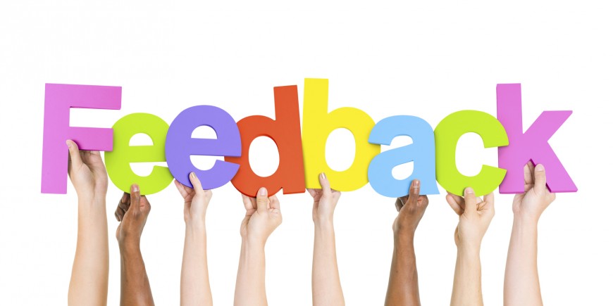 Multi Ethnic People Holding The Word Feedback